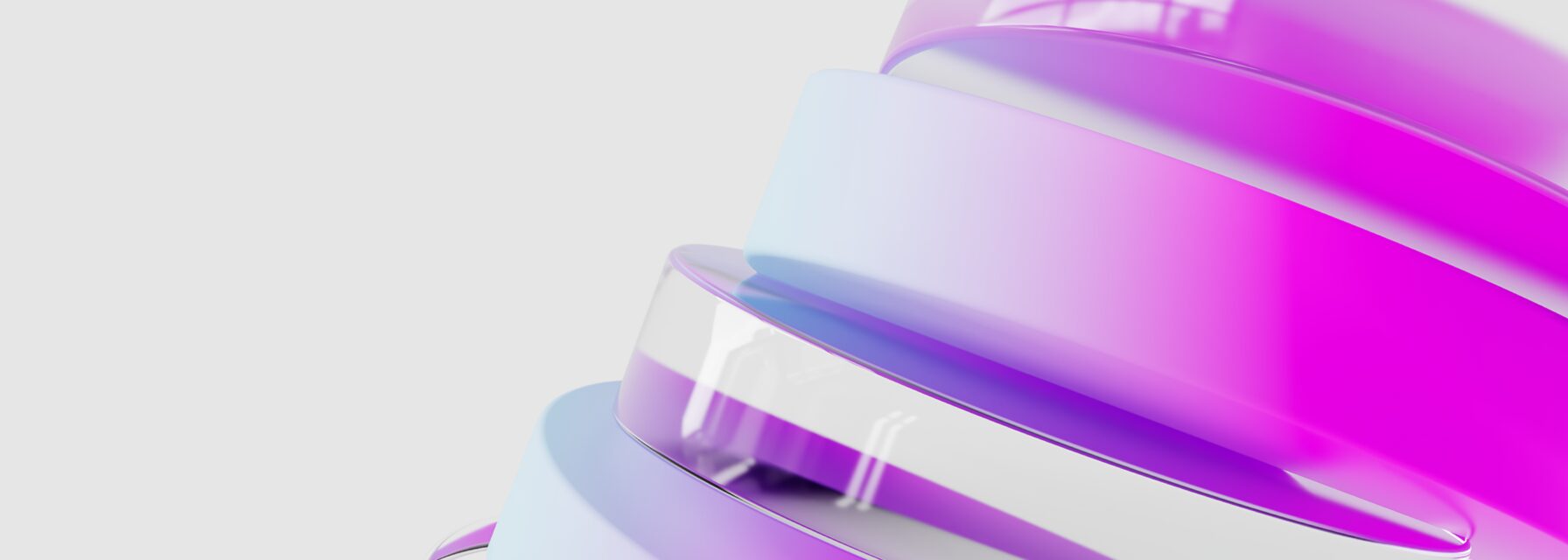 Close-up of a spiral structure with smooth, glossy surfaces featuring alternating translucent and opaque bands in shades of light blue and vibrant pink, set against a plain light gray background.