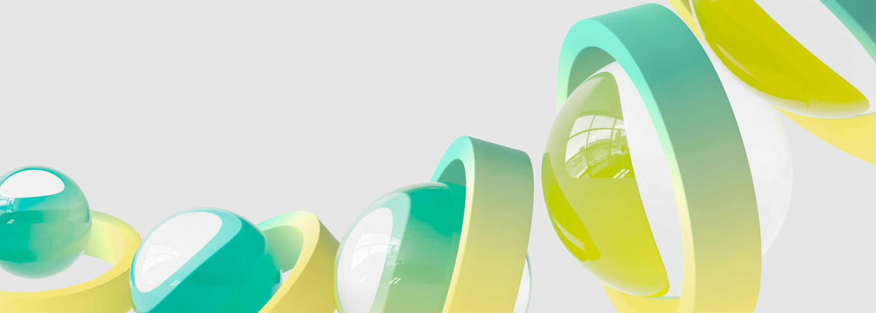 Abstract design featuring glossy spheres encased in semi-transparent teal-to-yellow gradient rings on a light grey background.