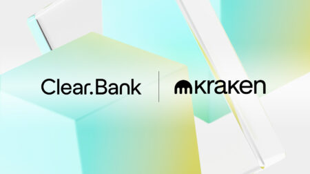 Logo featuring 'Clear.Bank' on the left and 'kraken' on the right, separated by a vertical line, set against a background of abstract pastel-colored geometric shapes in blue, green, and yellow.