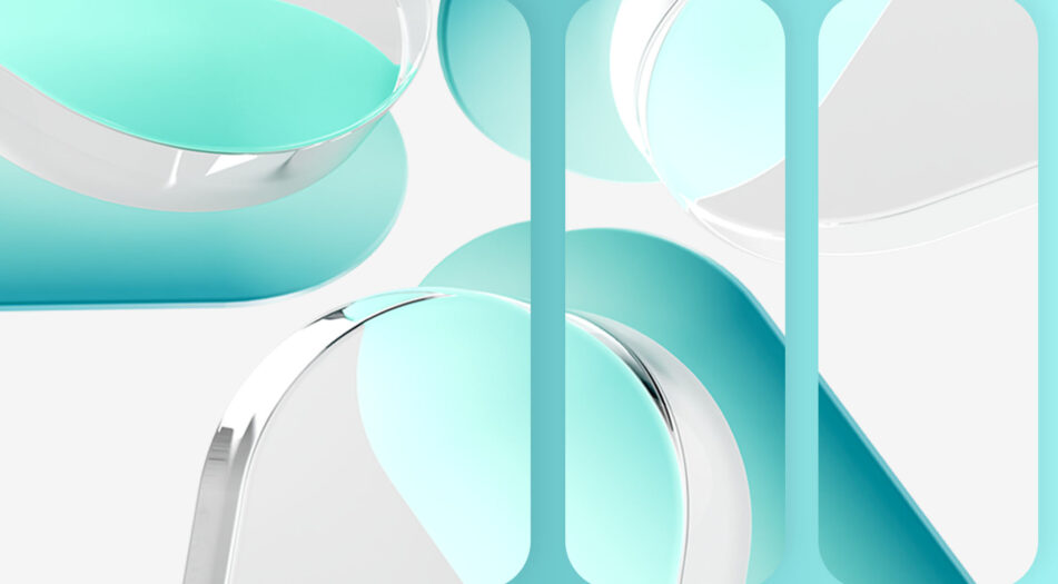 Close-up of four translucent, pill-shaped objects with rounded edges, arranged in a circular pattern with their ends pointing toward the center.